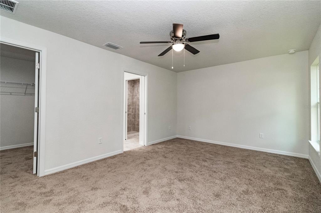 61 Larch Run Ocala, FL 34480 - Photo 13 of 26 a view of an empty room with wooden floor