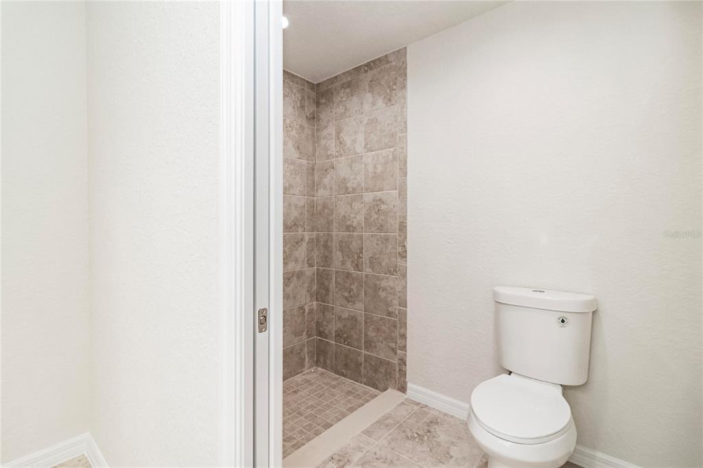 61 Larch Run Ocala, FL 34480 - Photo 16 of 26 a white toilet sitting next to a shower
