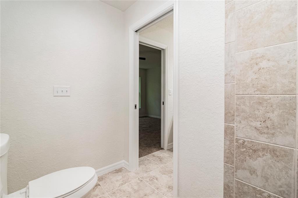 61 Larch Run Ocala, FL 34480 - Photo 18 of 26 a bathroom with a toilet