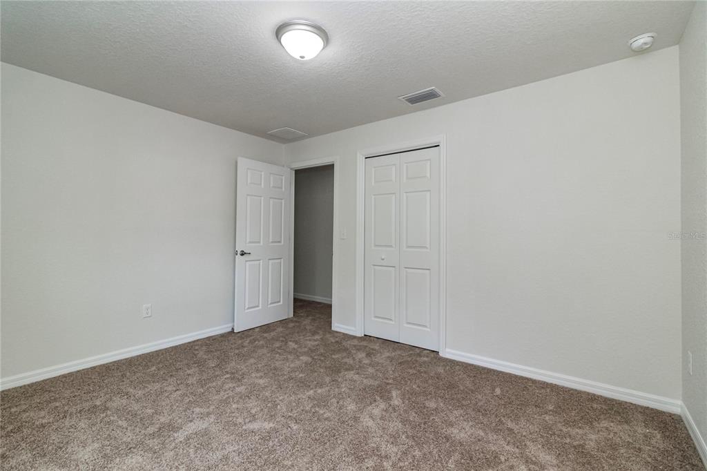 61 Larch Run Ocala, FL 34480 - Photo 22 of 26 an empty room with an entryway