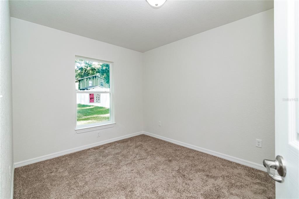 61 Larch Run Ocala, FL 34480 - Photo 24 of 26 an empty room with a window