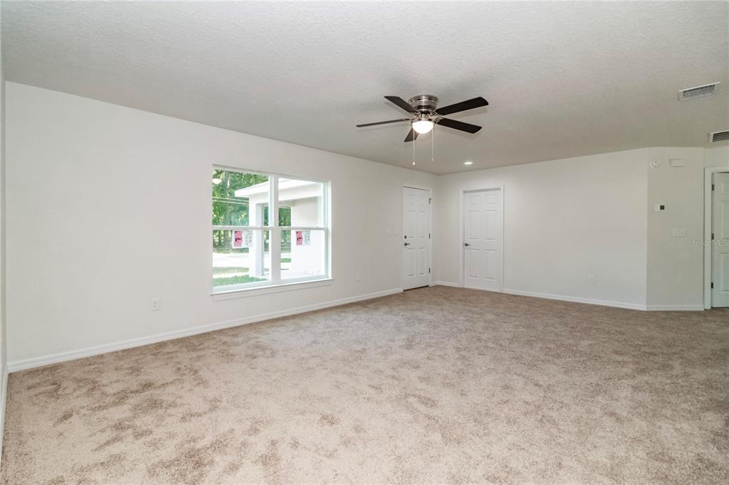 61 Larch Run Ocala, FL 34480 - Photo 4 of 26 a view of an empty room and a window