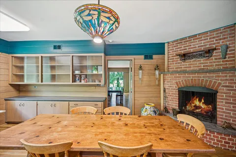 a bedroom with a bed and a fireplace