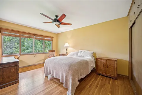 a bed room with a bed and a window