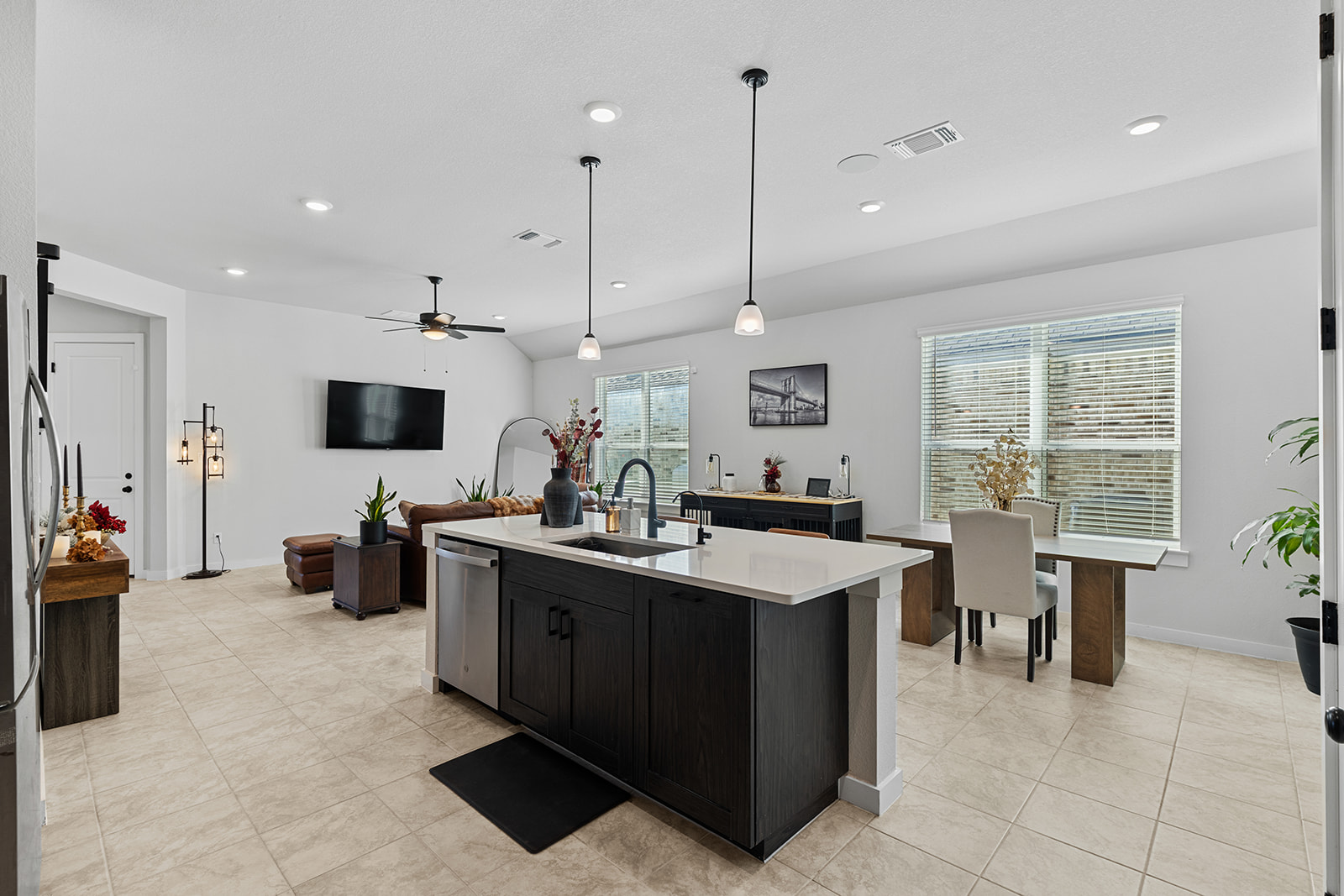 972 Leaning Oak Lane Georgetown, TX 78628 - Photo 33 of 33 a kitchen with stainless steel appliances a stove a sink a oven a dining table and chairs