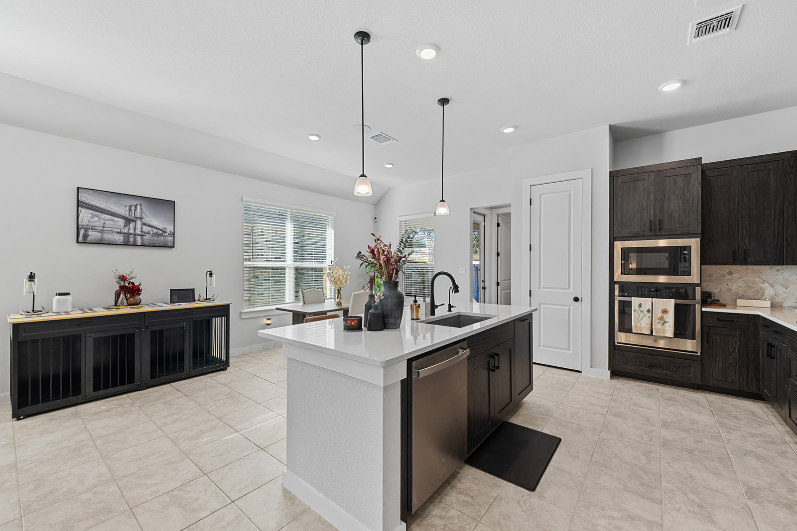 972 Leaning Oak Lane Georgetown, TX 78628 - Photo 10 of 33 a kitchen with stainless steel appliances kitchen island granite countertop a sink and cabinets