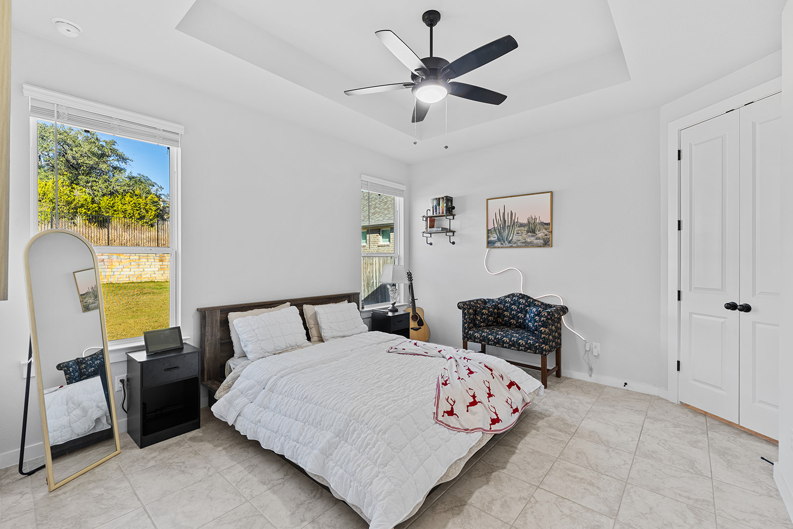 972 Leaning Oak Lane Georgetown, TX 78628 - Photo 12 of 33 a bedroom with a bed and a chandelier