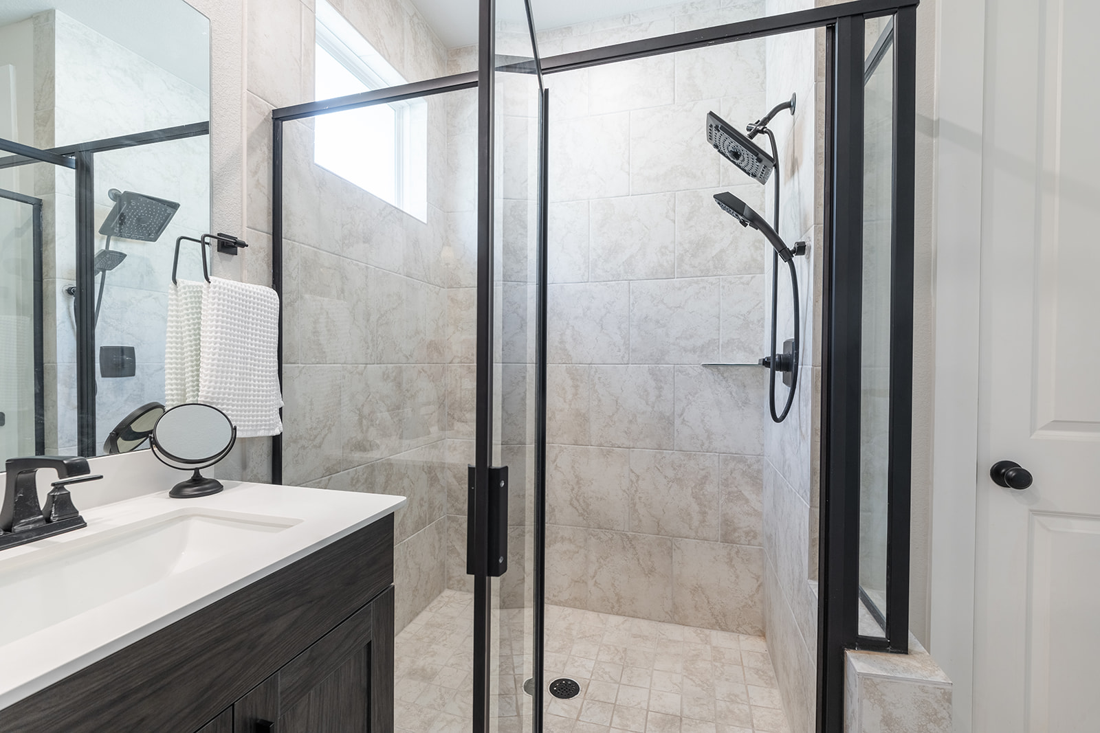 972 Leaning Oak Lane Georgetown, TX 78628 - Photo 15 of 33 a bathroom with a shower sink and mirror