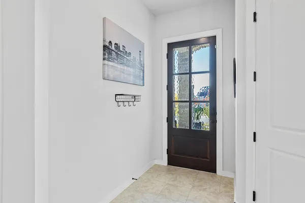 a bathroom with a double vanity sink mirror and shower