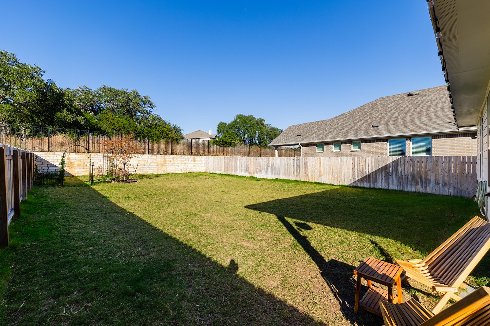 972 Leaning Oak Lane Georgetown, TX 78628 - Photo 25 of 33 a view of a backyard with a garden and plants