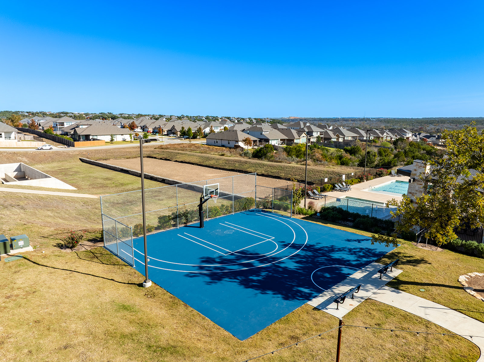 972 Leaning Oak Lane Georgetown, TX 78628 - Photo 31 of 33 a view of a swimming pool with an ocean view