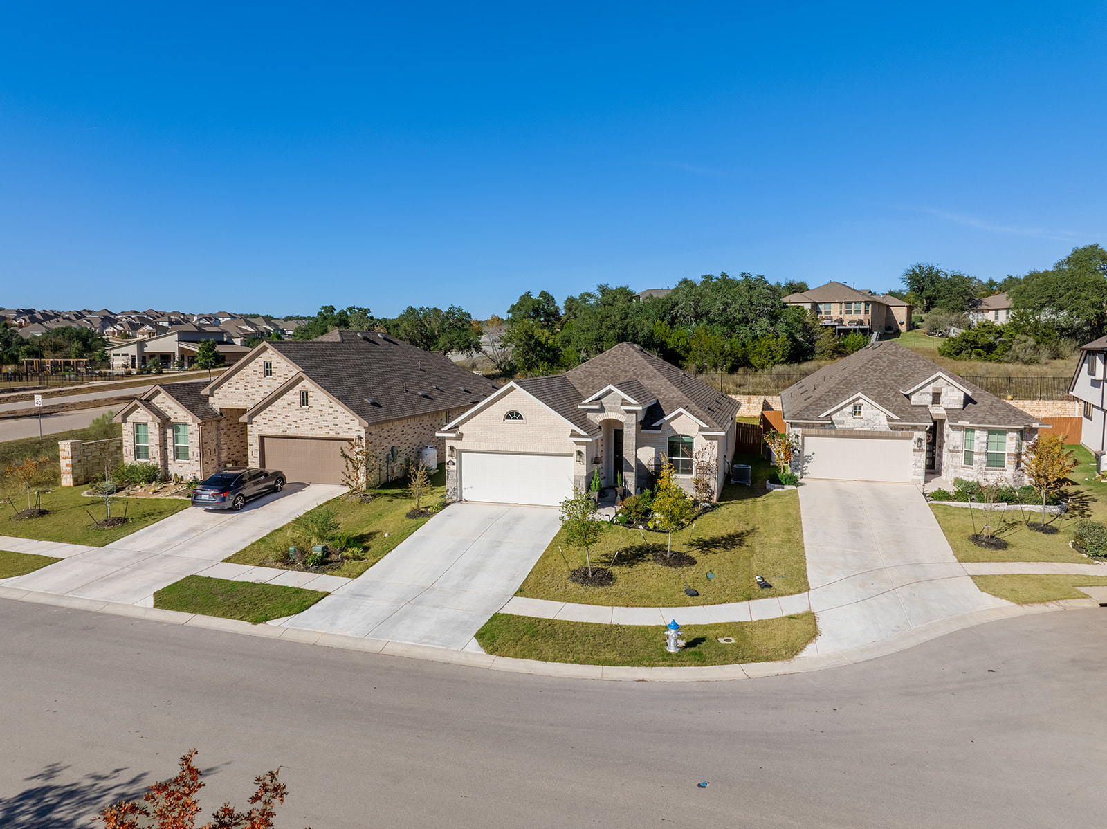 972 Leaning Oak Lane Georgetown, TX 78628 - Photo 3 of 33 an aerial view of residential houses with outdoor space and street view