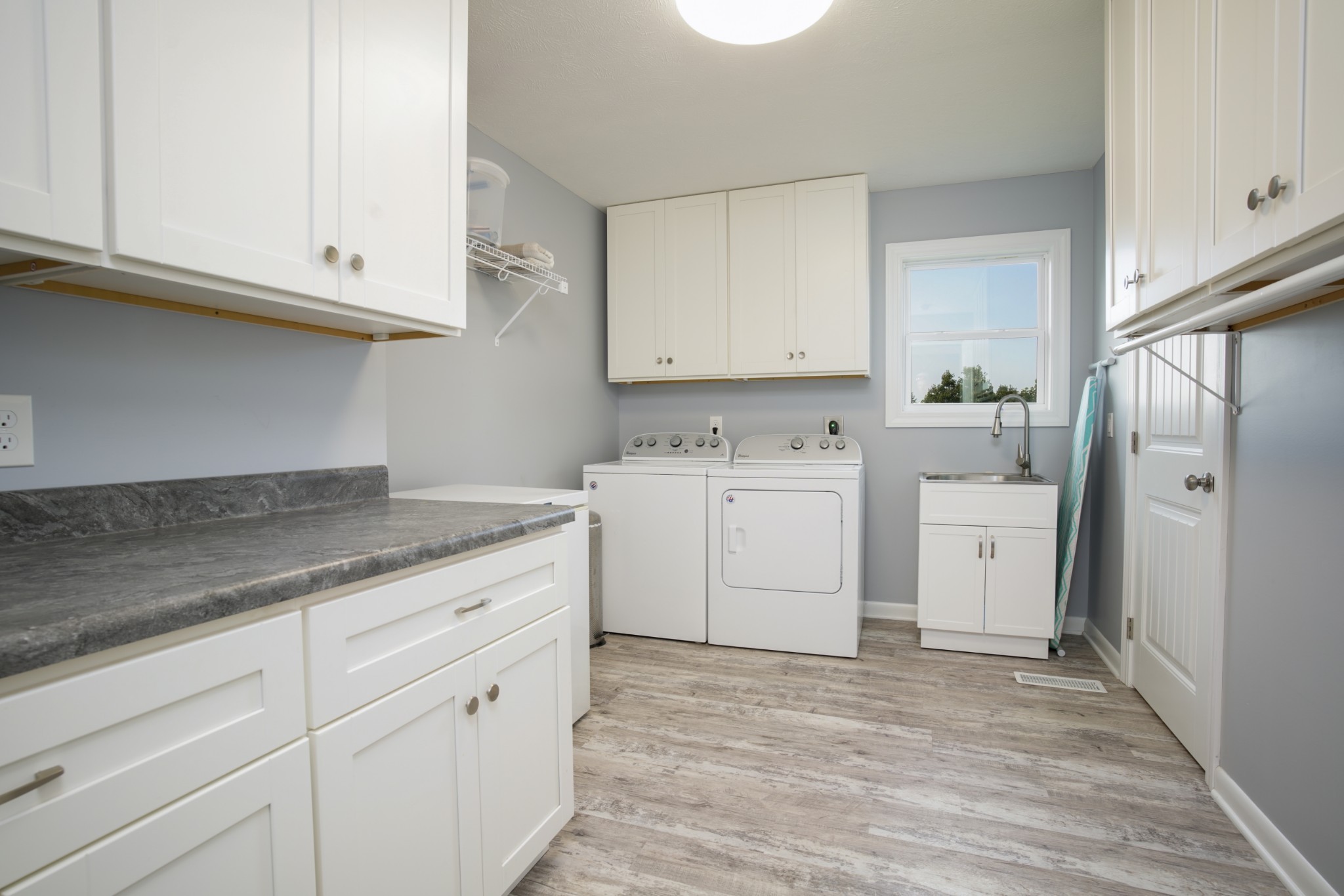 108 Eagle Drive Waynesboro, TN 38485 - Photo 16 of 29 a kitchen with white cabinets and white appliances