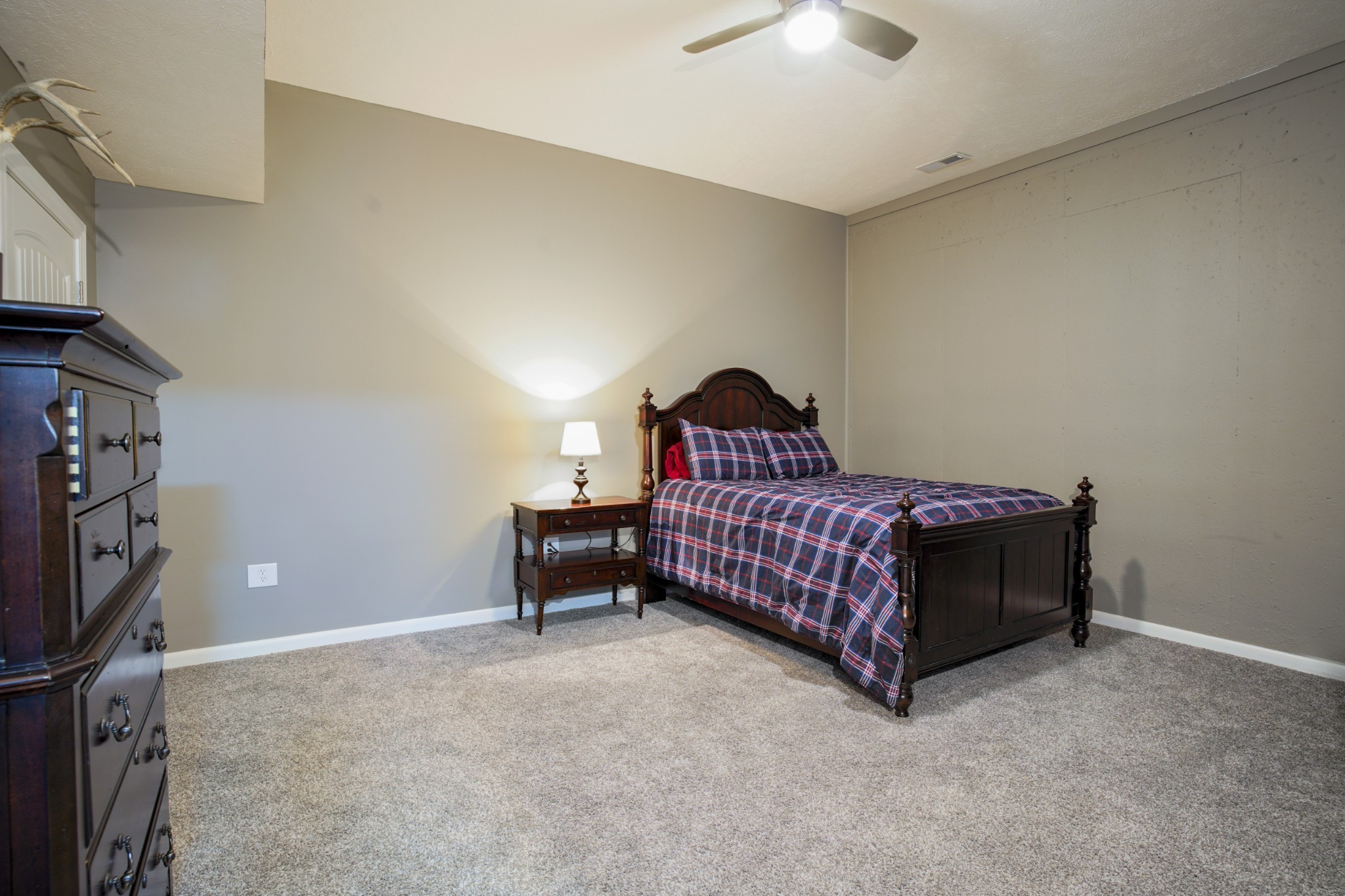 108 Eagle Drive Waynesboro, TN 38485 - Photo 18 of 29 a bedroom with a bed and a chandelier