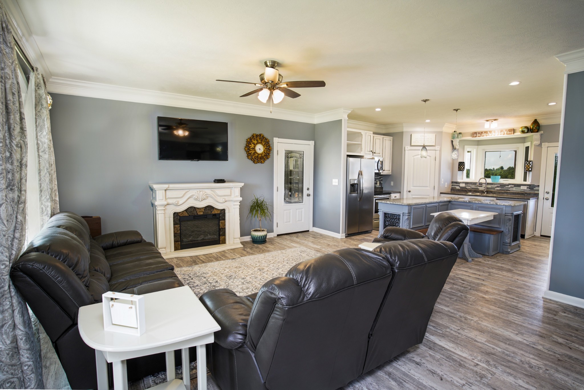 108 Eagle Drive Waynesboro, TN 38485 - Photo 4 of 29 a living room with furniture a fireplace and a flat screen tv