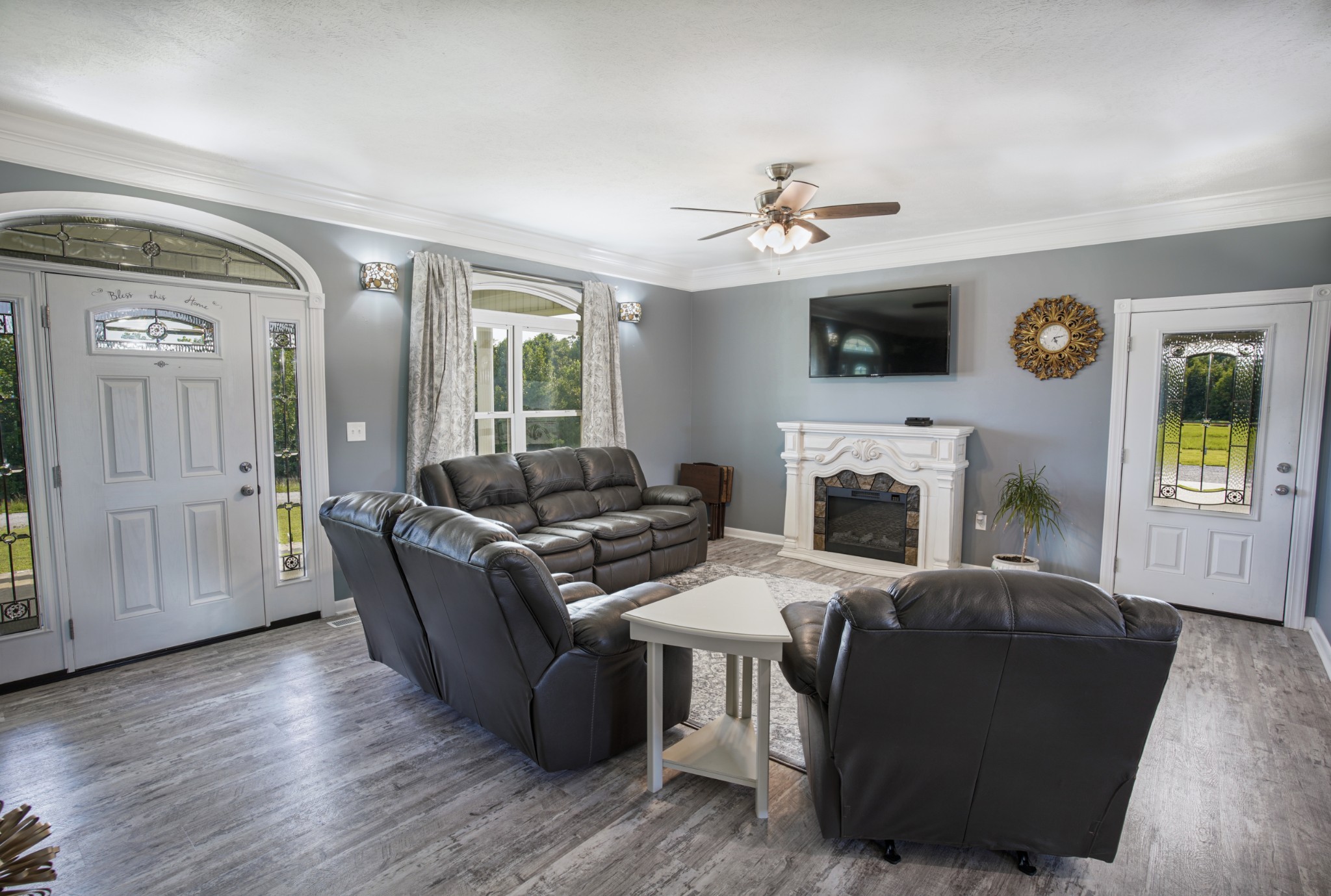 108 Eagle Drive Waynesboro, TN 38485 - Photo 5 of 29 a living room with furniture a fireplace and a flat screen tv
