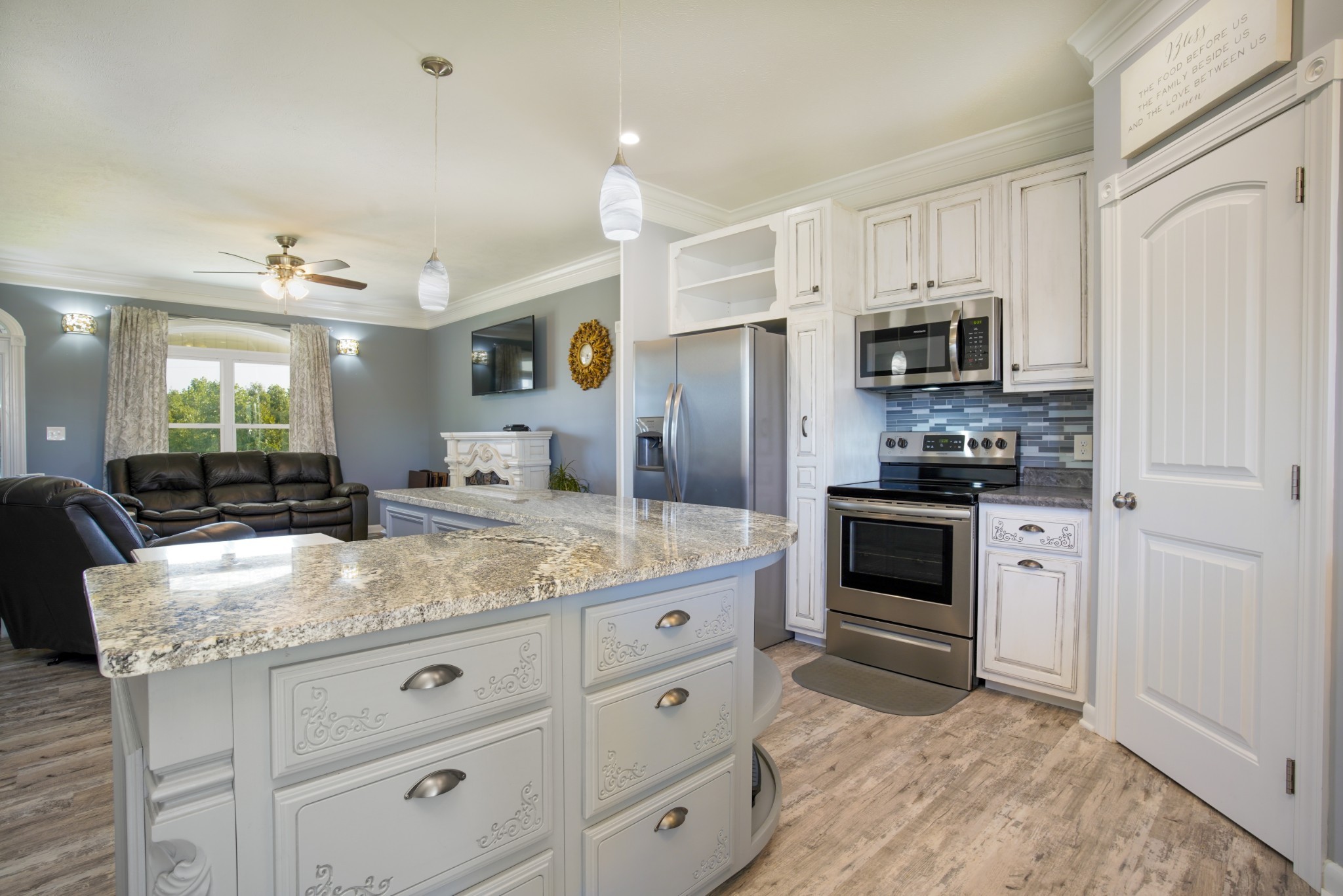 108 Eagle Drive Waynesboro, TN 38485 - Photo 8 of 29 a kitchen with stainless steel appliances granite countertop a sink stove and refrigerator