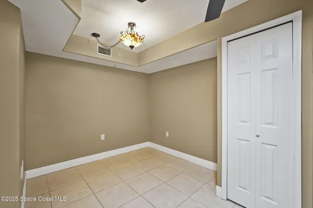 a large kitchen with stainless steel appliances kitchen island granite countertop a refrigerator and a sink