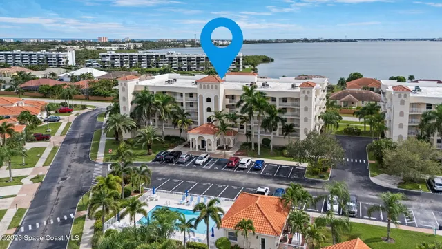 a view of a lake with a table and chairs