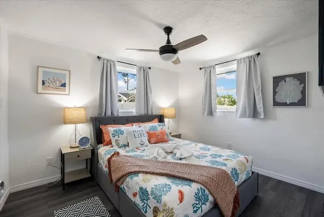 a bedroom with bed and a window