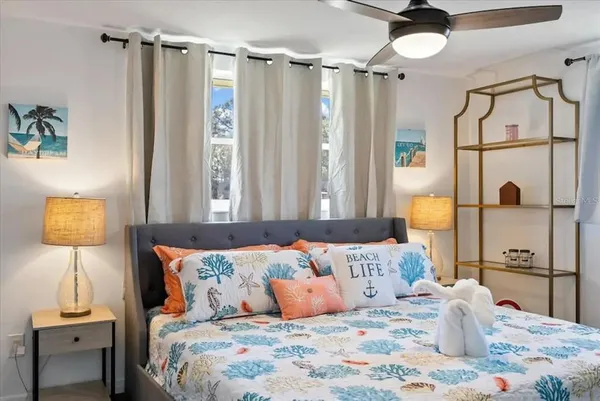 a bedroom with a bed and a table