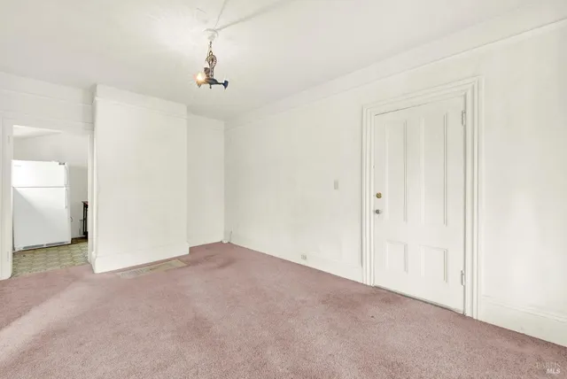 an empty room with closet area