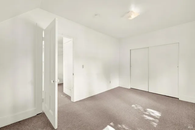 a view of a bathroom with a shower curtain