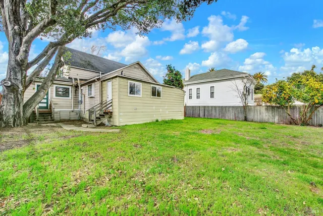 a view of a house with a big yard