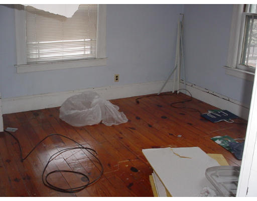 14 Converse Street Springfield, MA 01108 - Photo 3 of 8 a bed with a bed and a window