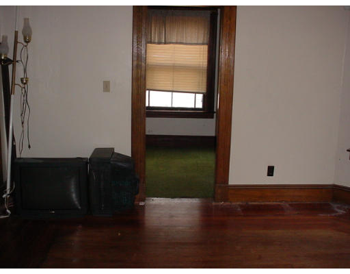 14 Converse Street Springfield, MA 01108 - Photo 5 of 8 a view of empty room with wooden floor and fan
