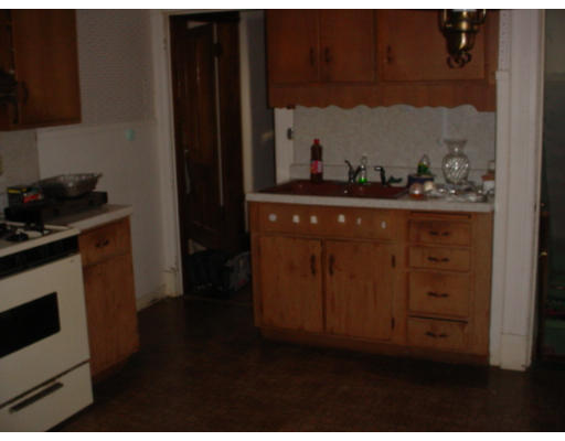 14 Converse Street Springfield, MA 01108 - Photo 6 of 8 a kitchen with cabinets and wooden floor