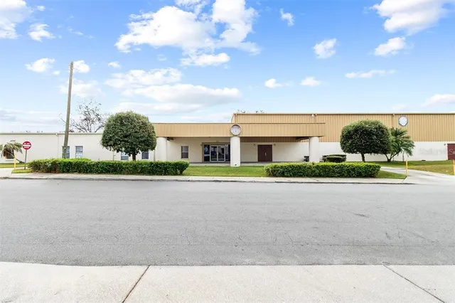 a front view of a house with a garden and pathway