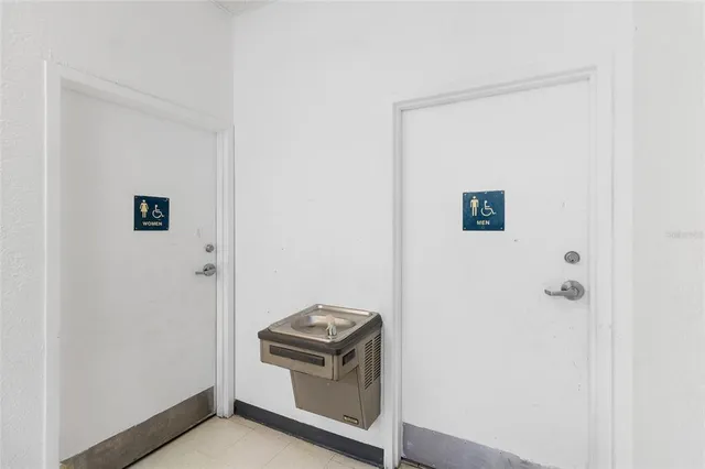 a bathroom with a shower and a sink