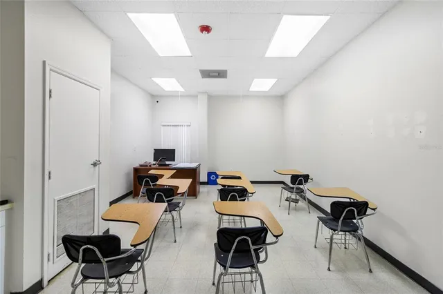 a view of an empty room with a windows