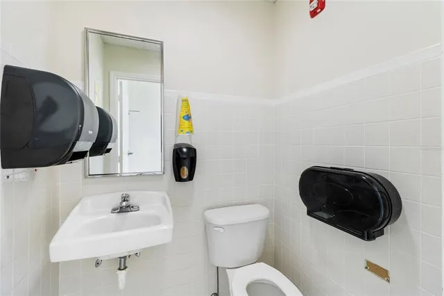 a view of a hallway with a large window and painted walls