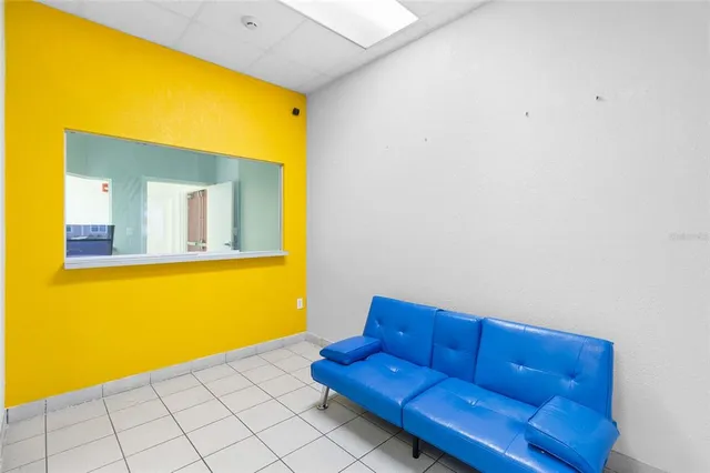 a view of an entryway with cabinet