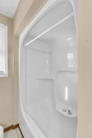 a bathroom with a glass shower door