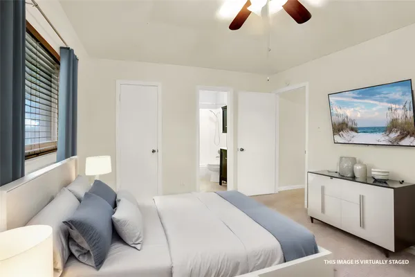 a bedroom with a bed and furniture