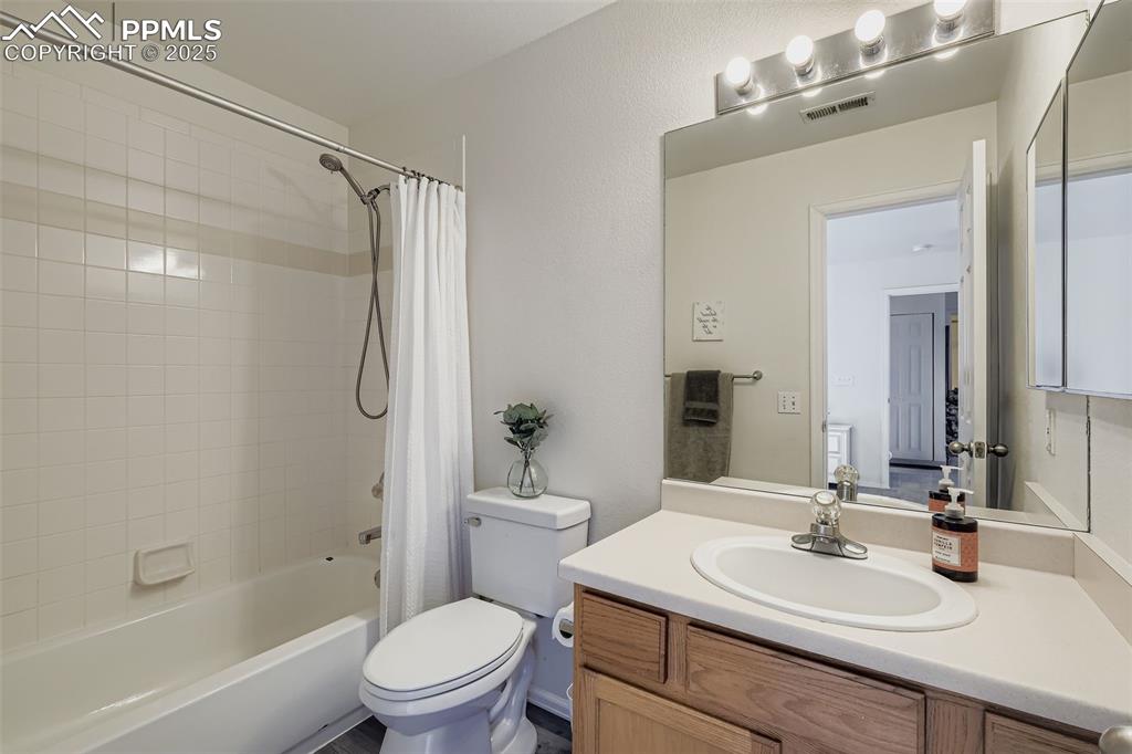 283 Ellers Grove Colorado Springs, CO 80916 - Photo 12 of 17 a bathroom with a sink toilet tub and shower