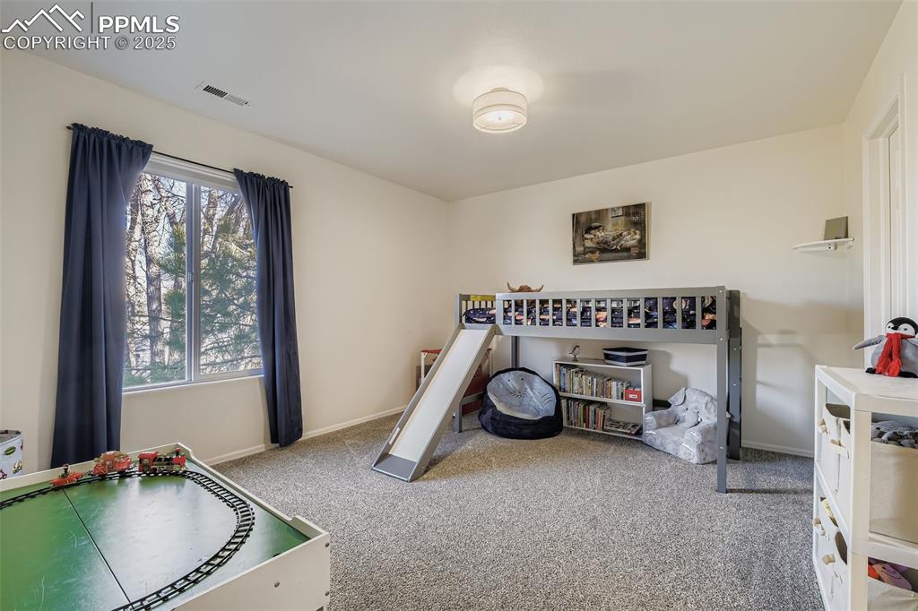 283 Ellers Grove Colorado Springs, CO 80916 - Photo 13 of 17 a room with furniture and a window