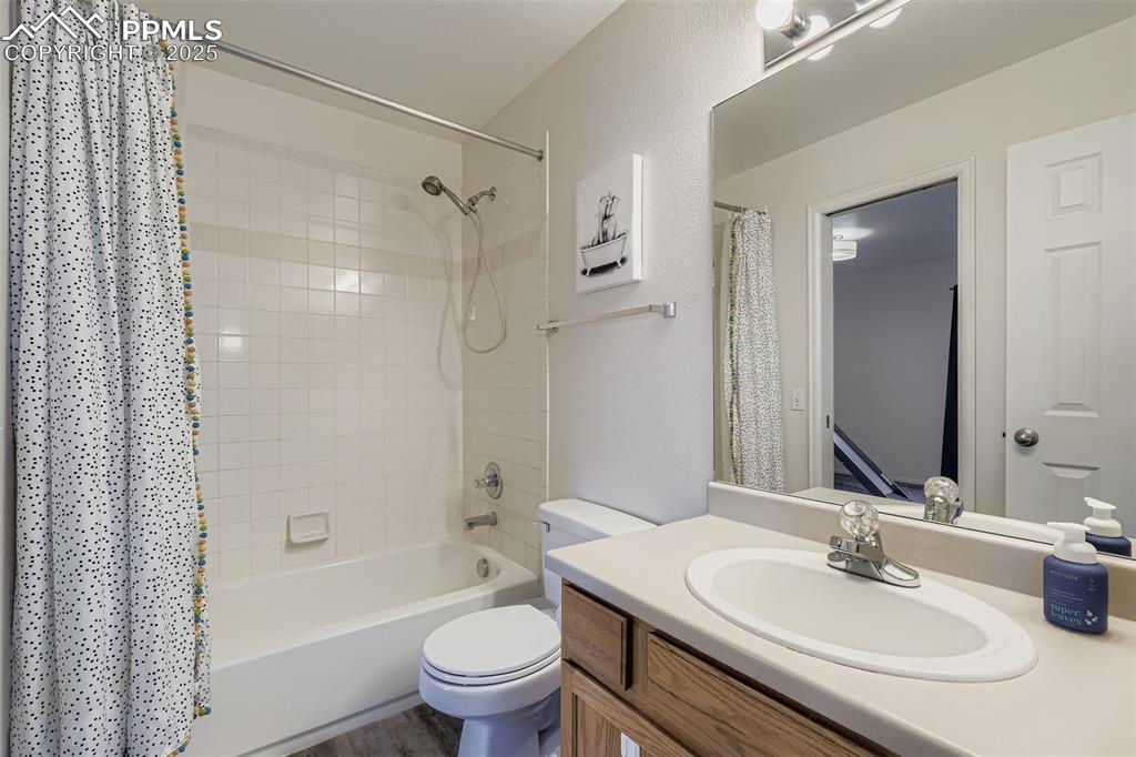 283 Ellers Grove Colorado Springs, CO 80916 - Photo 14 of 17 a bathroom with a sink toilet tub vanity and shower