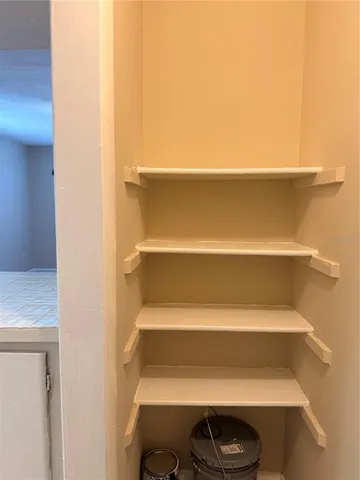 a view of storage and utility room with empty racks