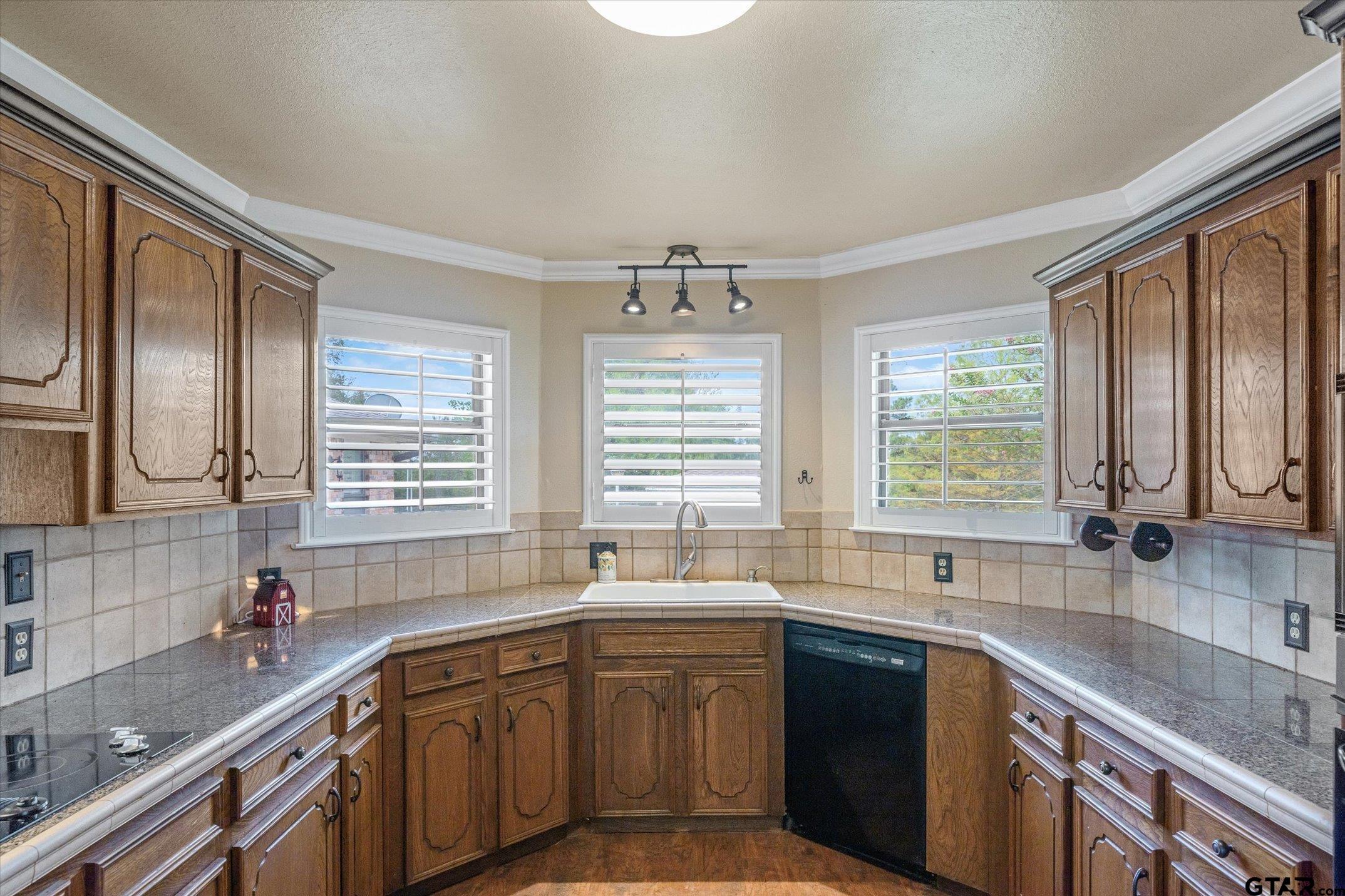 1936 Silver Maple Road Big Sandy, TX 75755 - Photo 14 of 48 a kitchen with stainless steel appliances granite countertop a sink a stove and cabinets