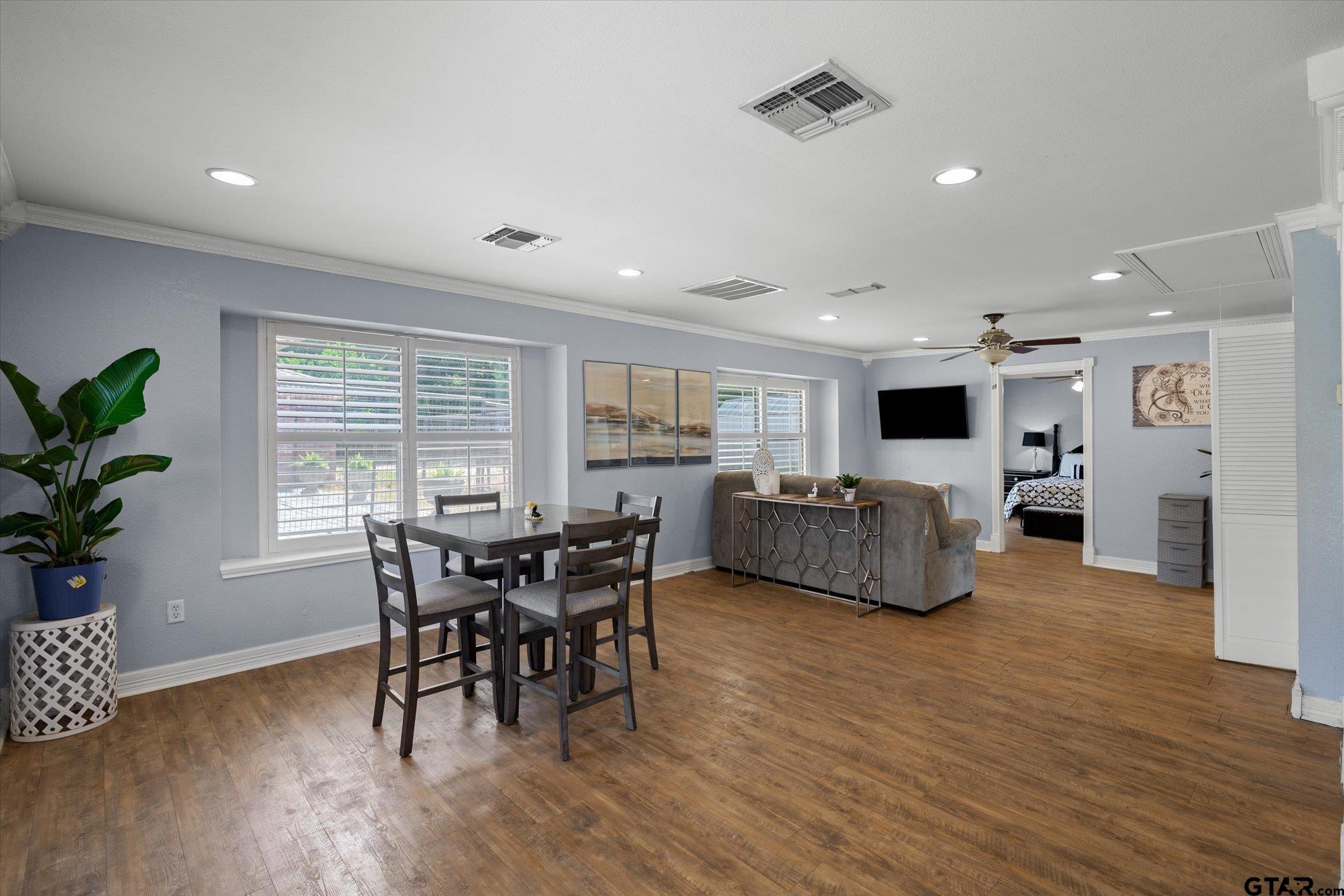 1936 Silver Maple Road Big Sandy, TX 75755 - Photo 25 of 48 a view of a dining room with furniture and wooden floor