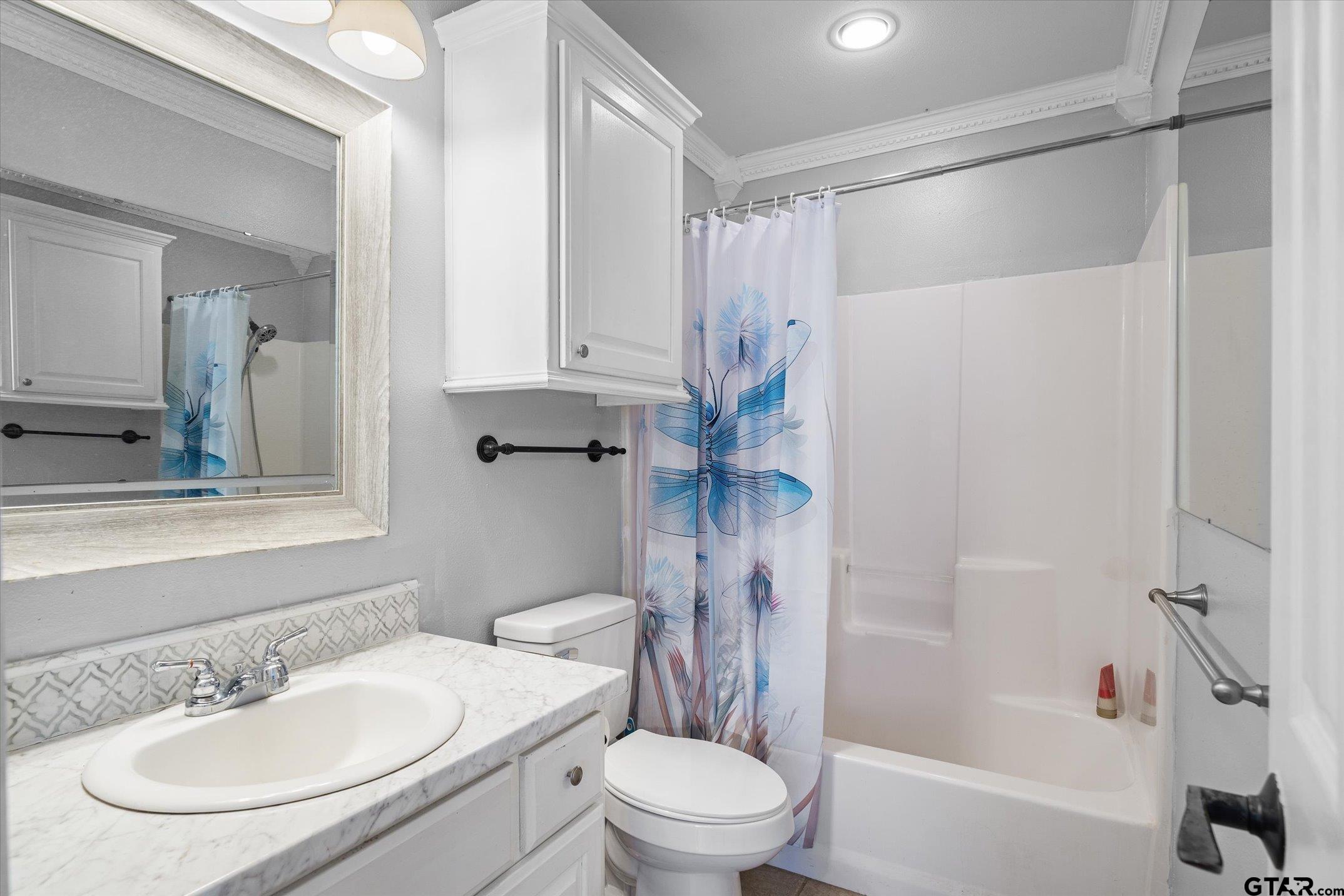 1936 Silver Maple Road Big Sandy, TX 75755 - Photo 27 of 48 a bathroom with a sink toilet and shower