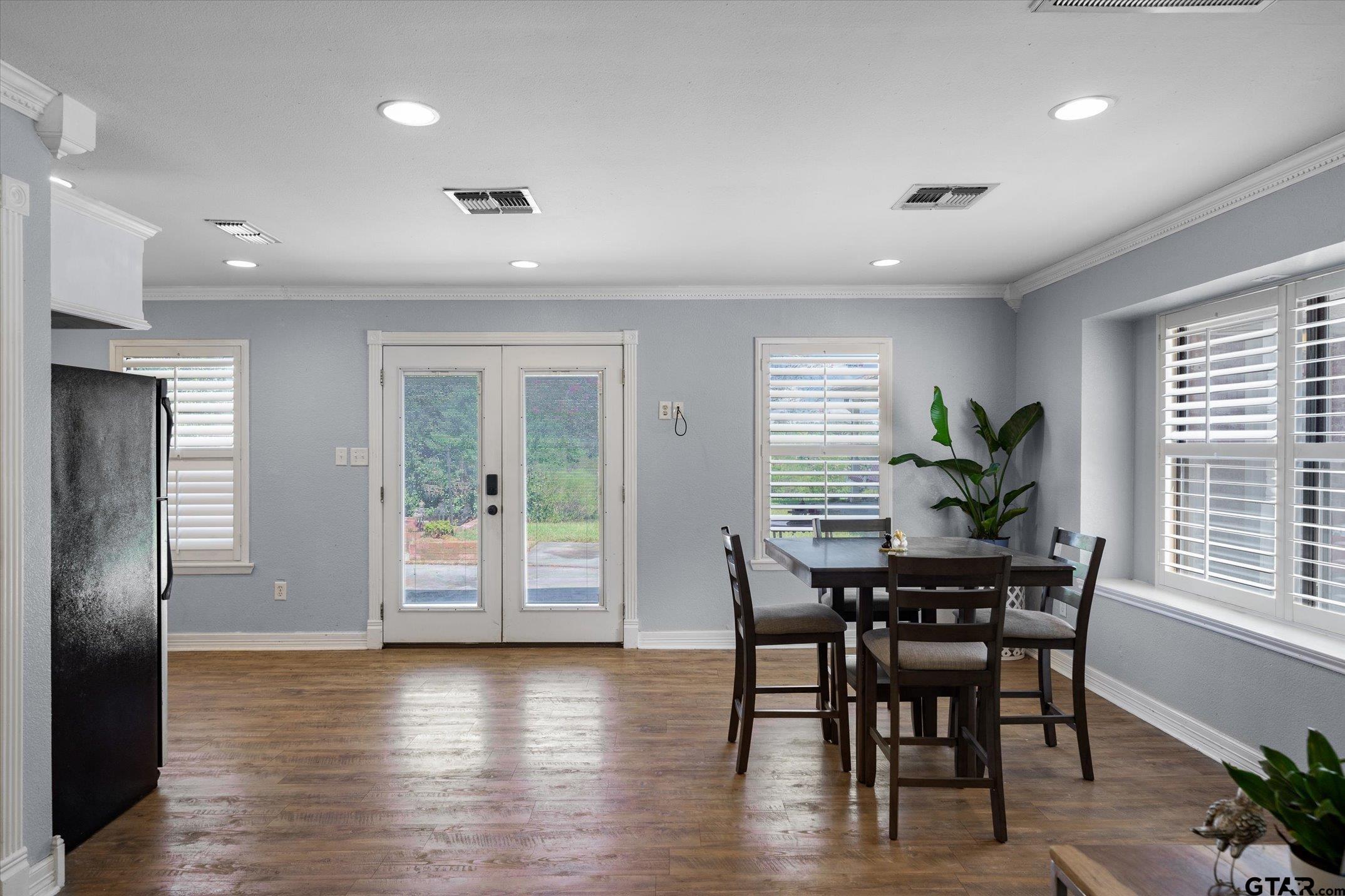 1936 Silver Maple Road Big Sandy, TX 75755 - Photo 28 of 48 a dining room with furniture and wooden floor