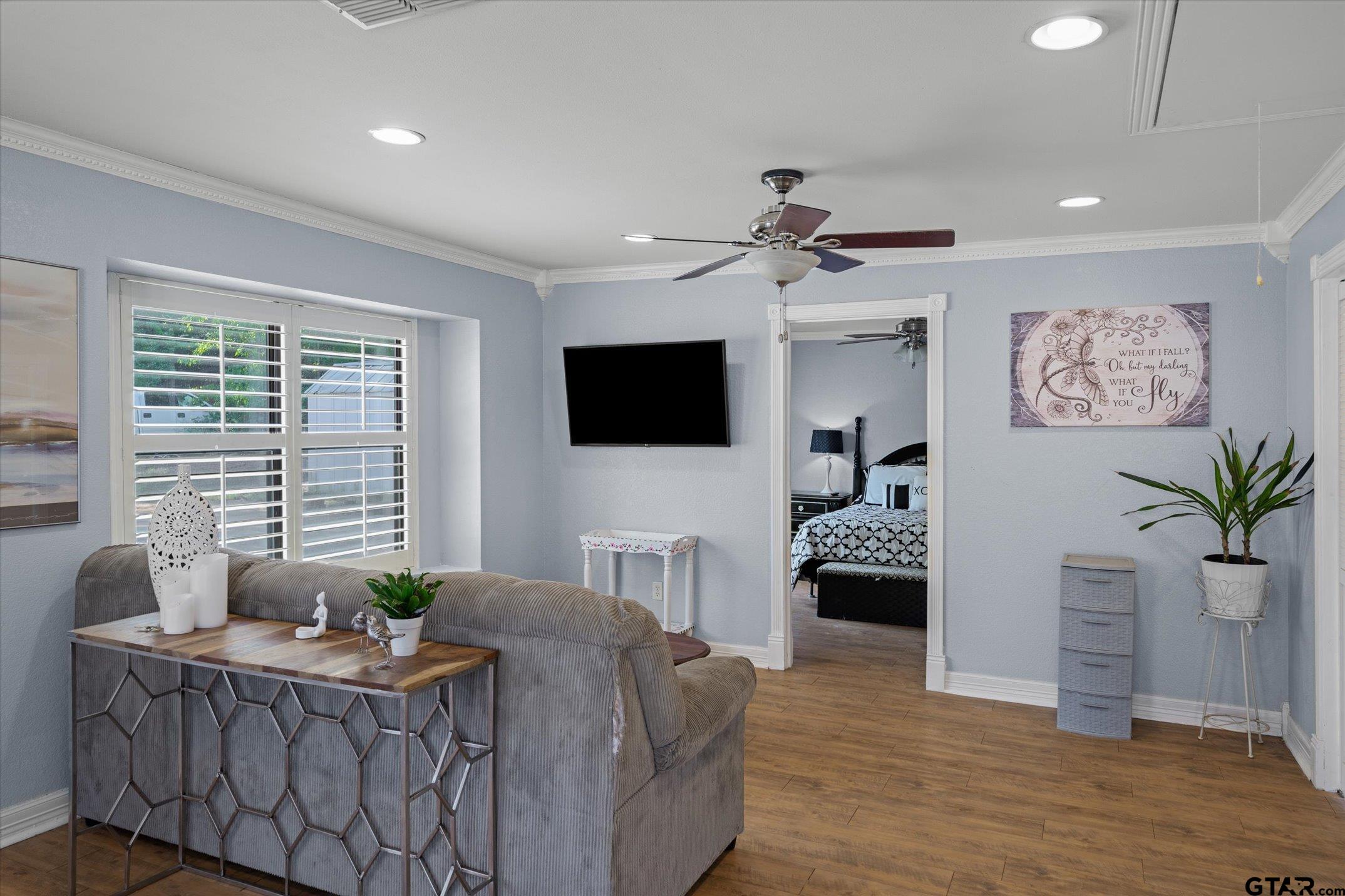 1936 Silver Maple Road Big Sandy, TX 75755 - Photo 29 of 48 a living room with furniture a flat screen tv and a large window