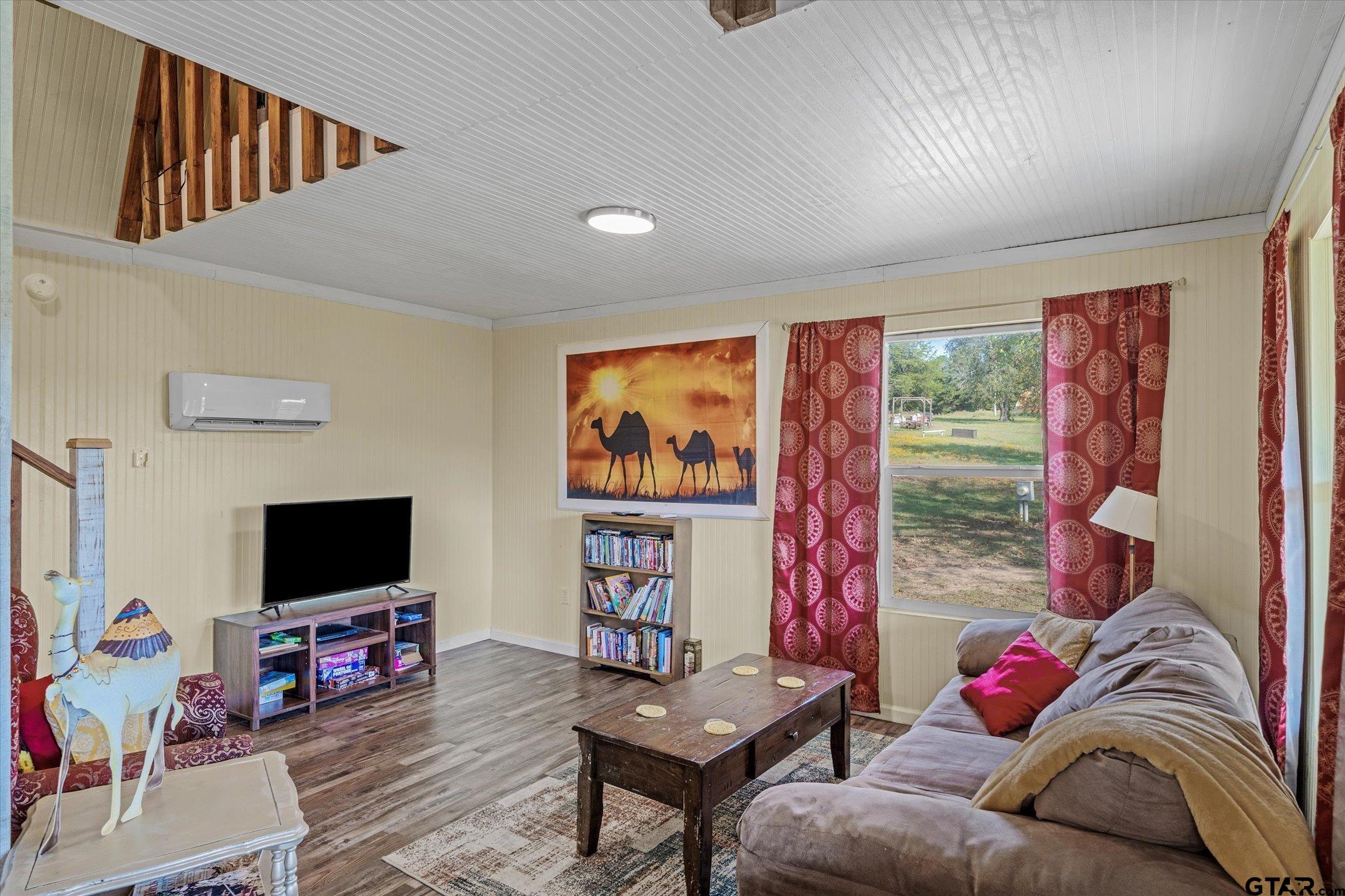 1936 Silver Maple Road Big Sandy, TX 75755 - Photo 35 of 48 a living room with furniture and a flat screen tv