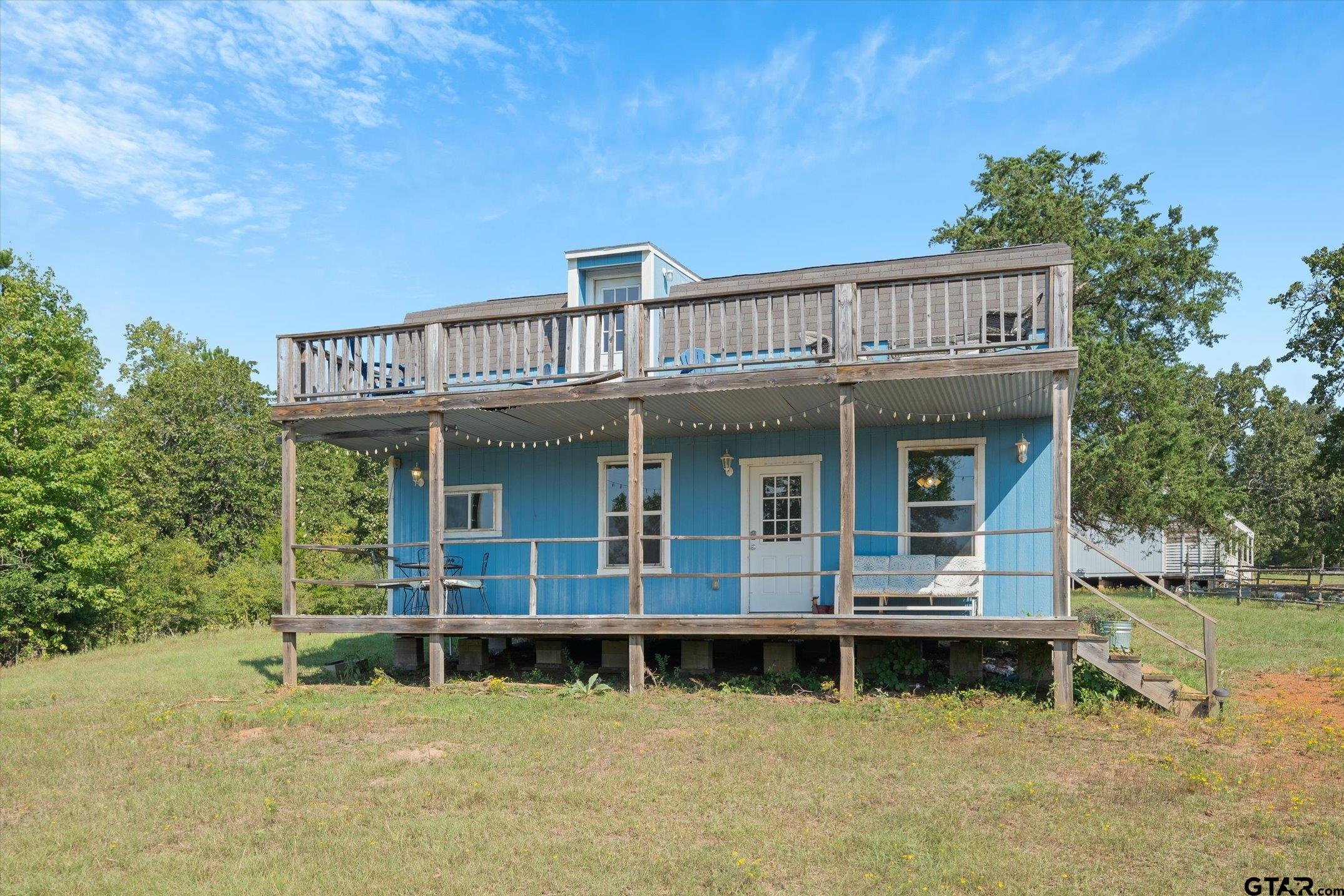 1936 Silver Maple Road Big Sandy, TX 75755 - Photo 38 of 48 a view of a house with a balcony