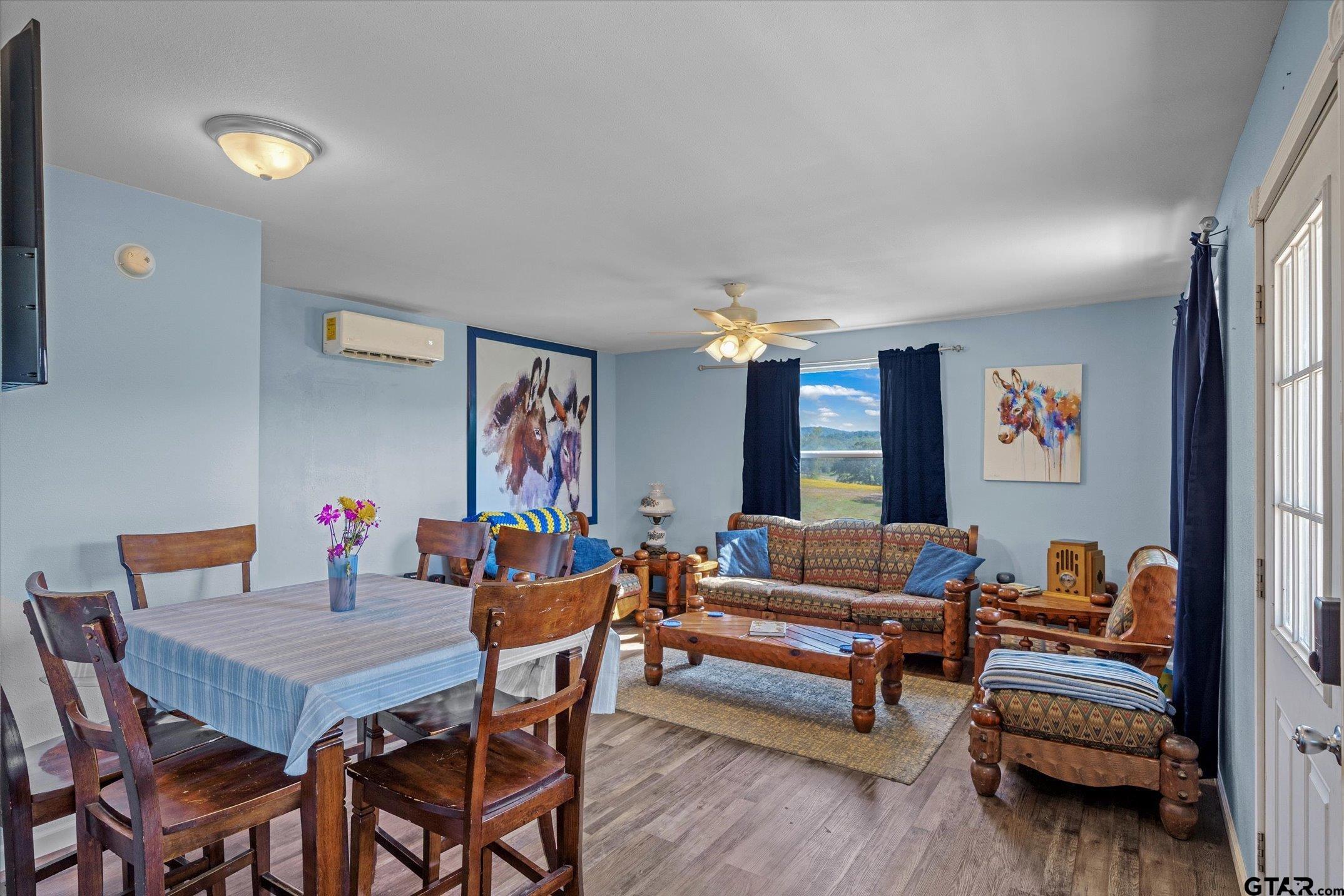 1936 Silver Maple Road Big Sandy, TX 75755 - Photo 40 of 48 a living room with furniture and wooden floor